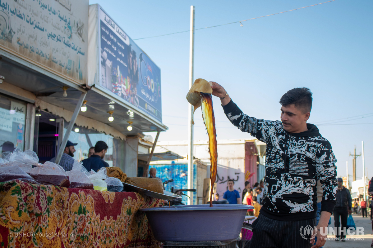 Rustom, a Syrian refugee, and shop owner in the market stalls in Zaatari camp sell Tamarind to the camps’ residents during Ramadan.