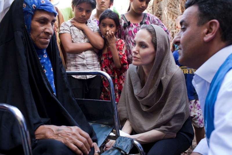 Angelina Jolie speaks with Iraqi refugees who fled Syria.