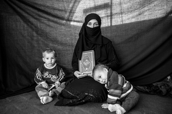 Iman, 25, with her son Ahmed and daughter Aishia, in Nizip refugee camp, Turkey.