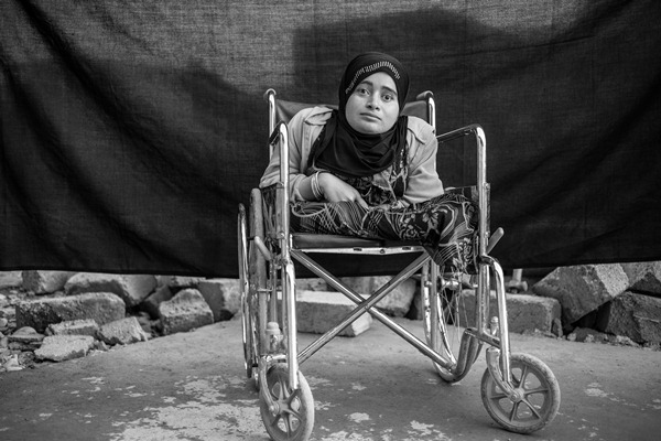 Alia sits in her wheelchair in Domiz refugee camp in the Kurdistan Region of Iraq.