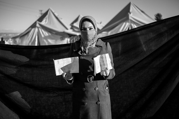 Tamara, 20, in Adiyaman refugee camp in Turkey. The most important thing she was able to bring with her is her diploma.