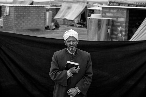 Mohamed, a 43-year-old refugee from Syria’s Hassakeh Governorate, is the imam of the only mosque in Domiz camp in the Kurdistan Region of Iraq. He holds the Koran, the most important thing that he was able to bring with him.