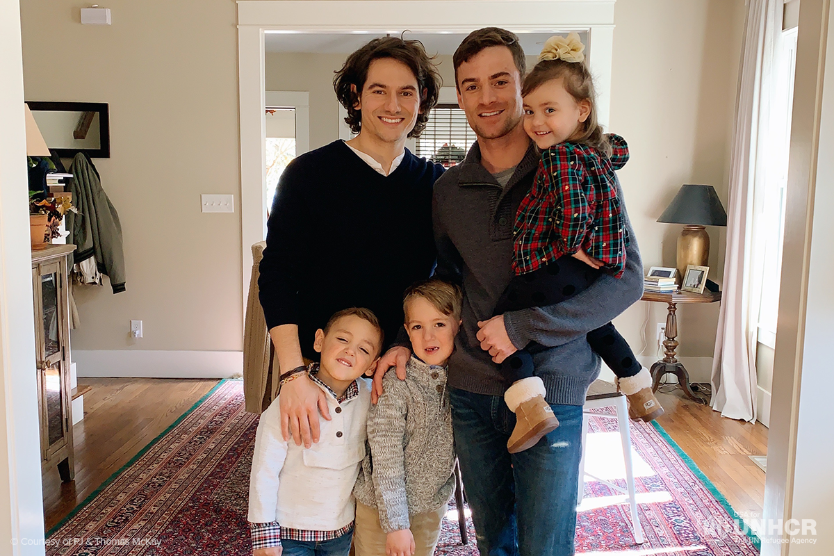portrait of pj and thomas with their three children