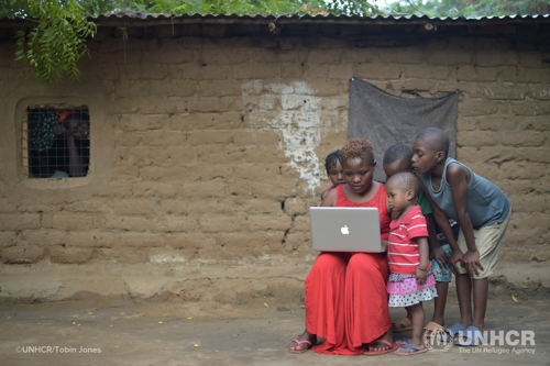 Aminah Rwimo, an award winning Congolese filmmaker, edits a film on her laptop near her home in Kakuma refugee camp, northern Kenya.