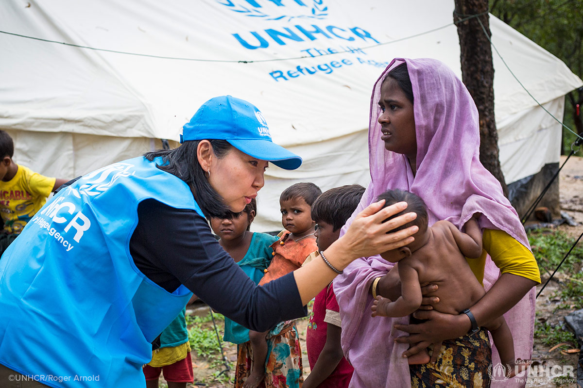 Joung-ah talks to a baby at a Rohingya refugee camp