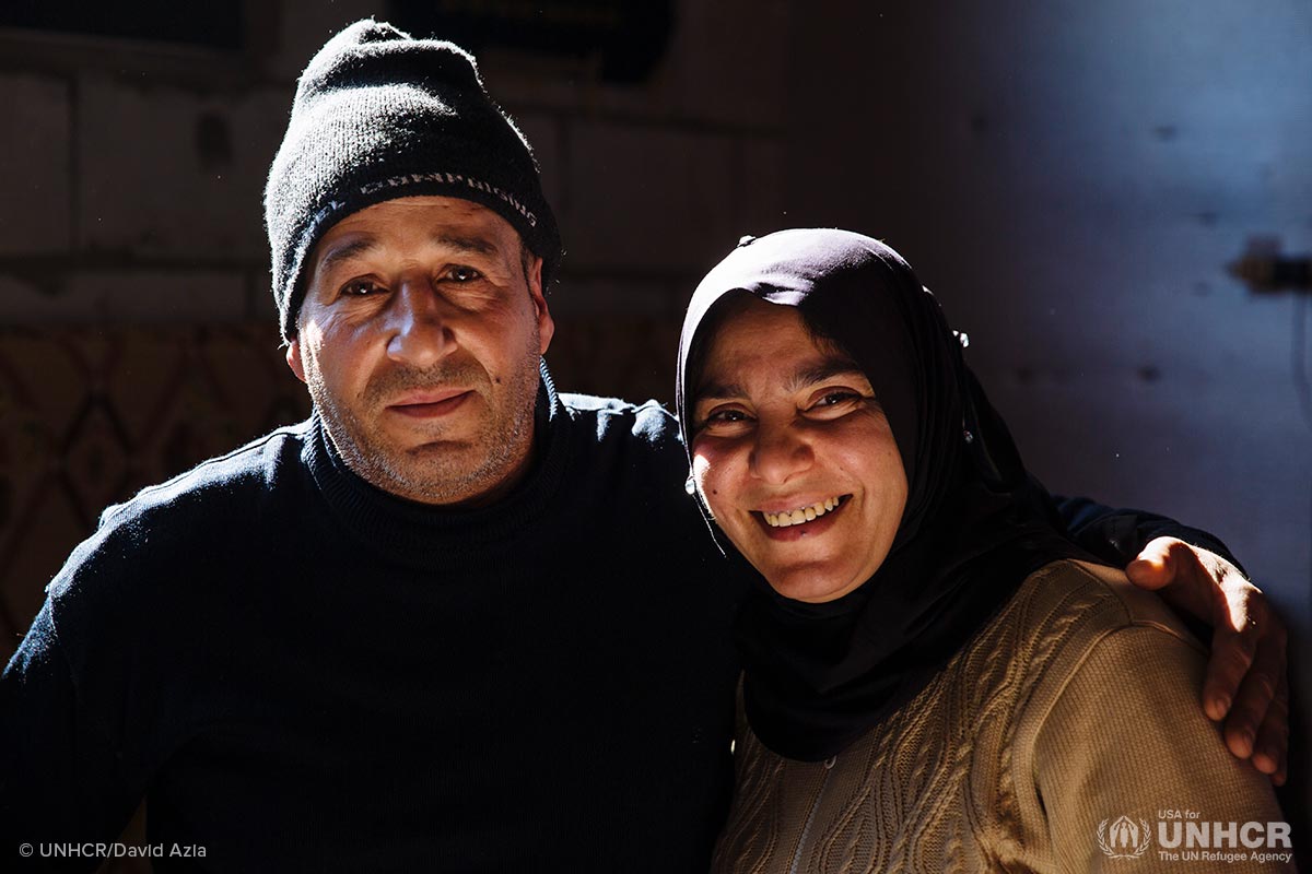 Khaled, 45, a Palestinian refugee displaced from Syria, and his wife Samira, 38, a Syrian refugee, sit on the floor of the apartment they share with their family in a substandard building in Barelias, Bekaa Valley, Lebanon.