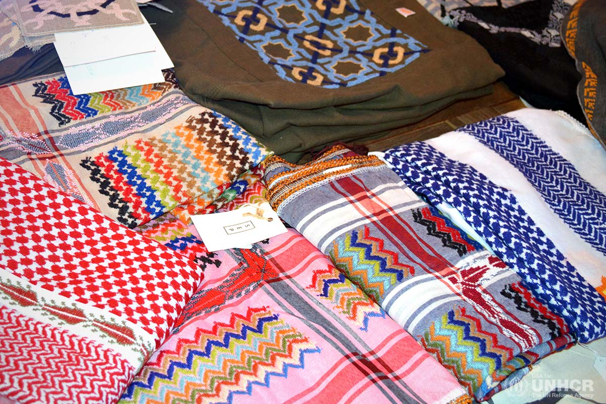 Colorful textiles from Made51 are displayed on a table.