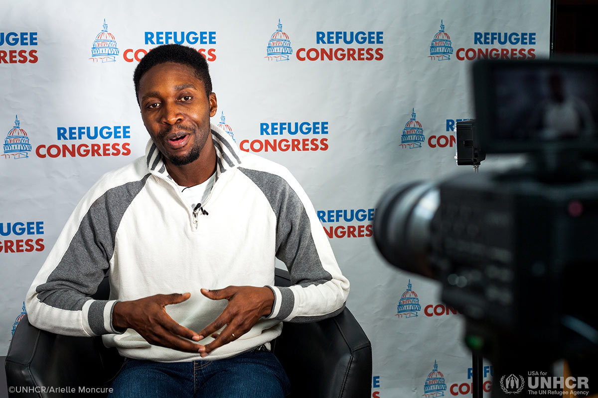 Refugee advocate, Fidel Nshombo, practices on-camera interviews.