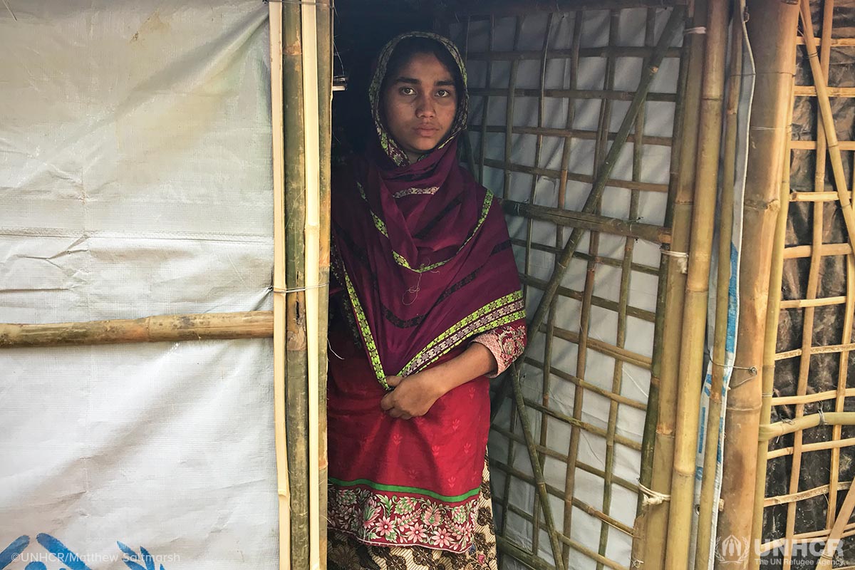 Sahar, 18, saw her mother, father and brother burned alive before she escaped her village in Myanmar. She lives alone in the densely crowded Kutupalong refugee camp, spending her nights in her bamboo-tarpaulin shelter, fearful of venturing out. During the day, she has companionship from her neighbour, with whom she shares menial tasks.