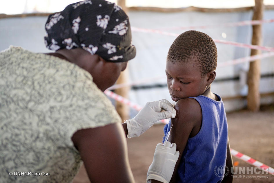 A child receive vaccination upon arrival at Imvepi reception center in Northern Uganda