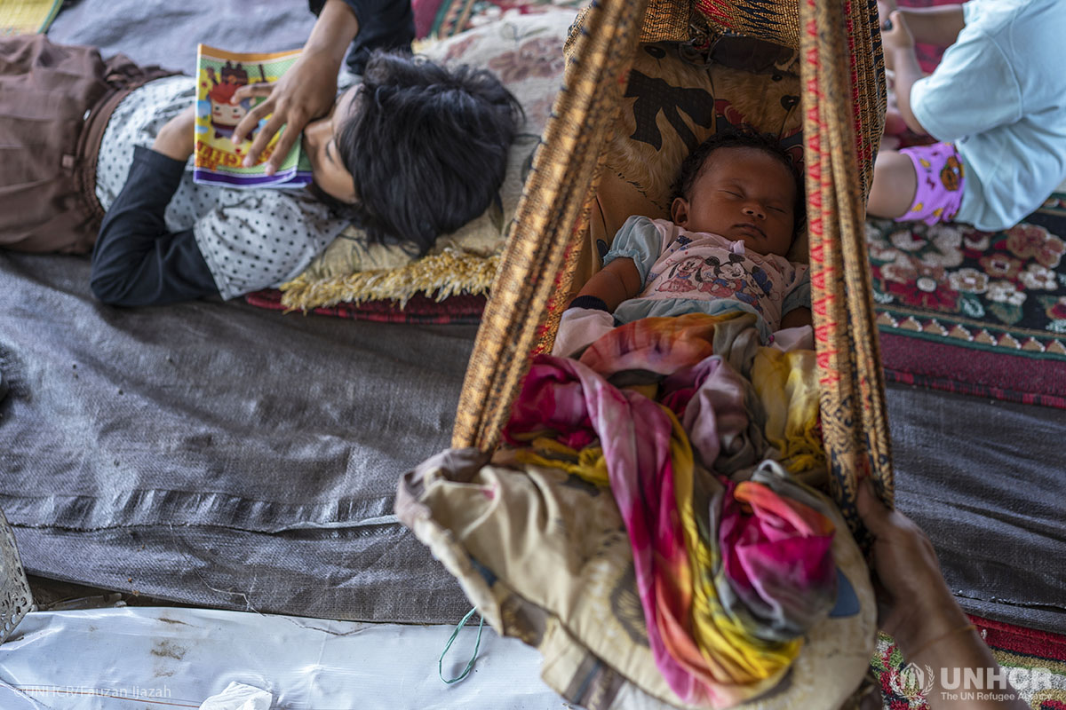 A baby seen in temporary shelter for survivors of earthquake.