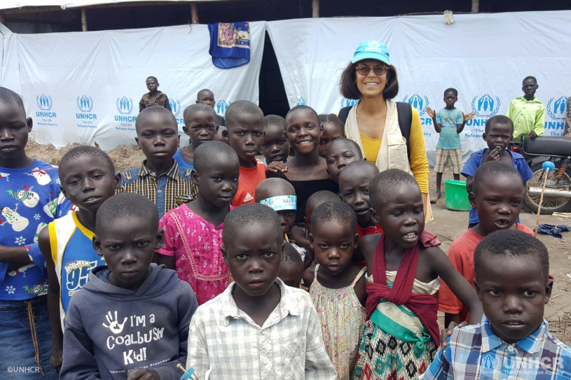 Massoumeh Farman Farmaian stops for a picture with South Sudanese refugee children in Uganda’s Rhino camp.