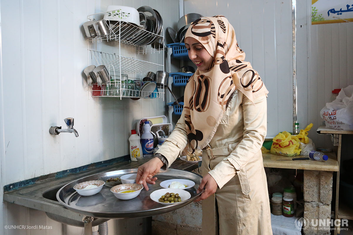 Syrian refugee Um Murad works behind-the-scenes in her wedding shop in Za'atari refugee camp.