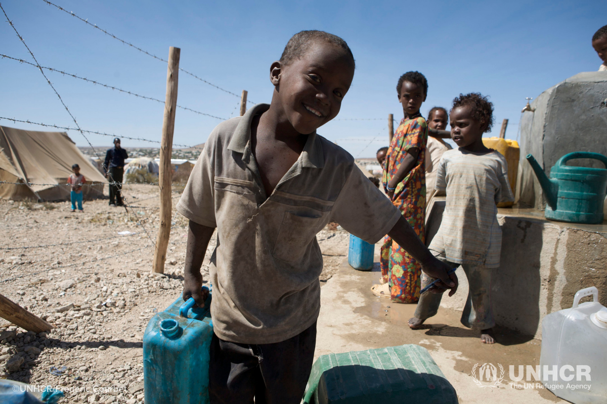 Young boy in Ethiopia carrying water