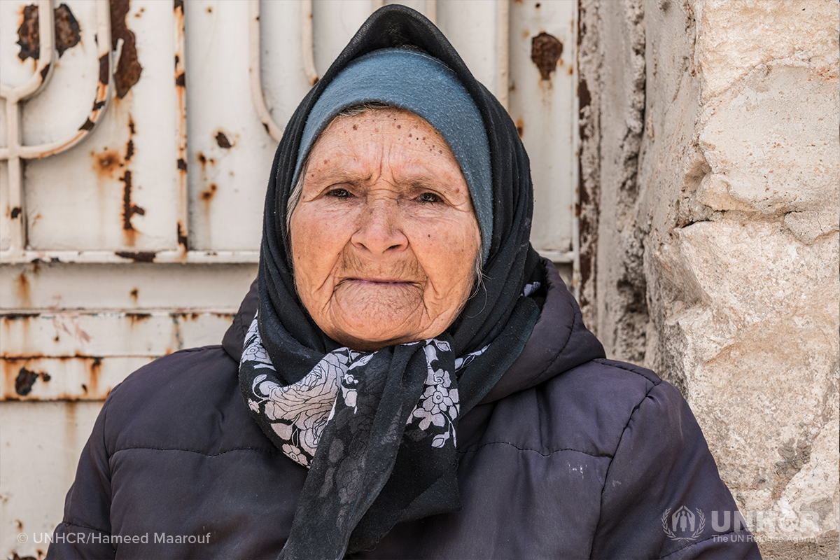 portrait of an elderly syrian refugee woman