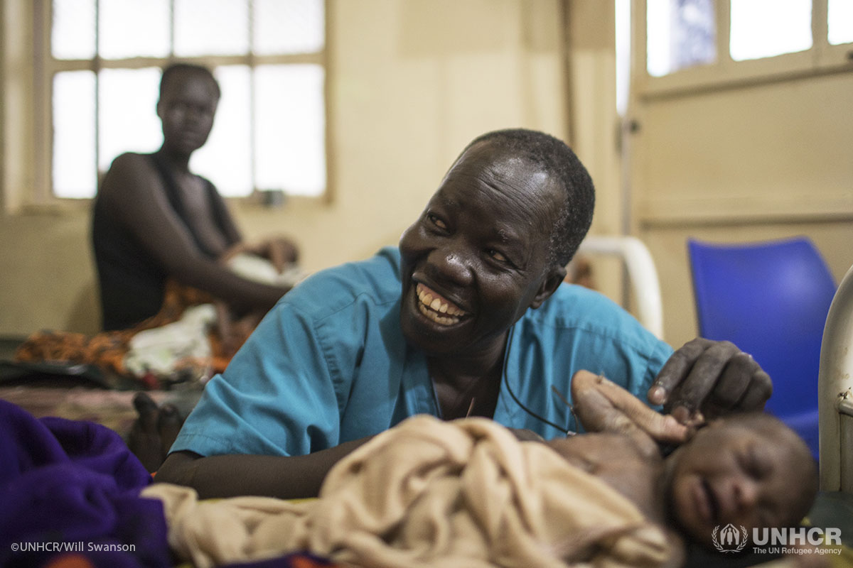 Dr. Evan Atar Adaha with the newborn baby of a refugee from Sudan in the maternity ward of the Maban Hospital in the town of Bunj, Maban County, South Sudan.