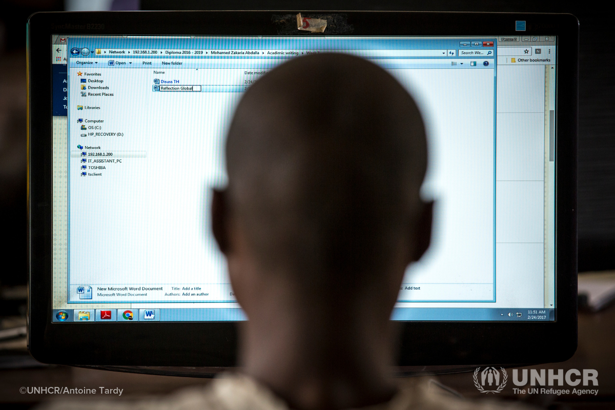 Refugee in Kakuma in front of computer