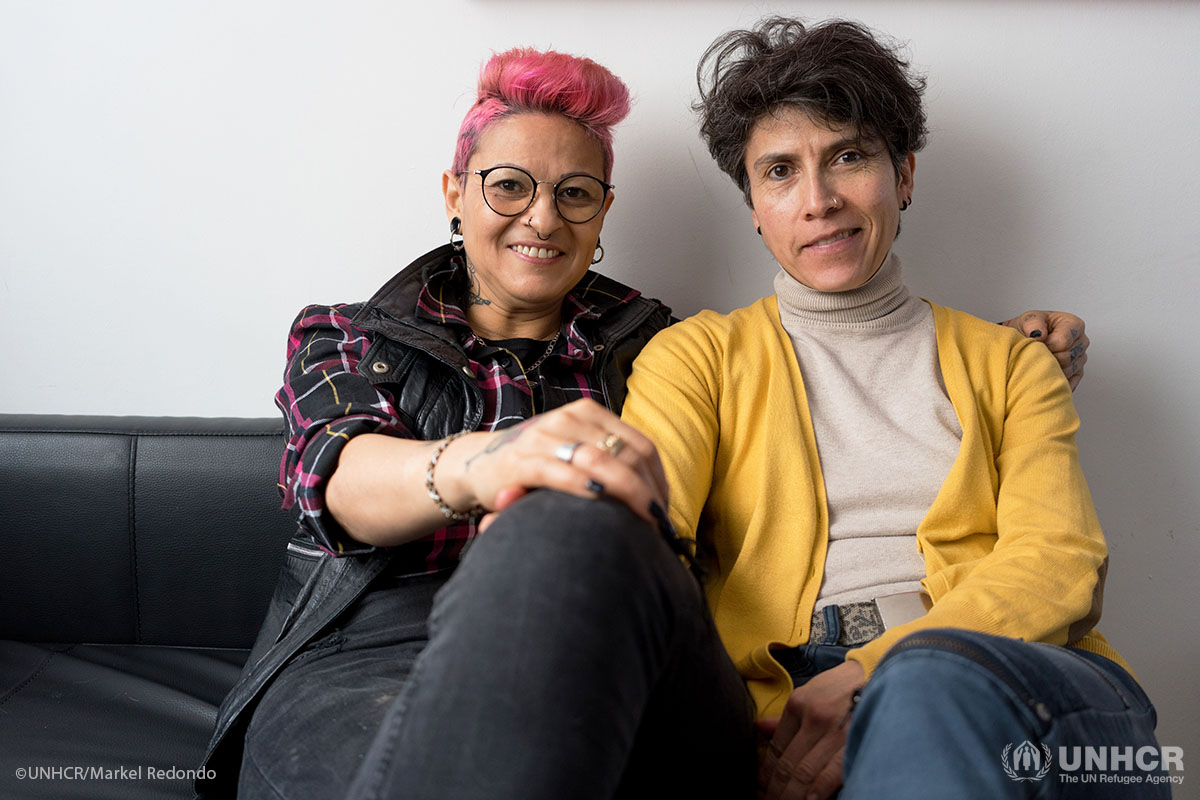 Honduran refugee Maritza, left, with her partner Jenny at their Barcelona apartment. The couple met online in 2015, established a tattoo studio together in the city and say they have found strength in one another.