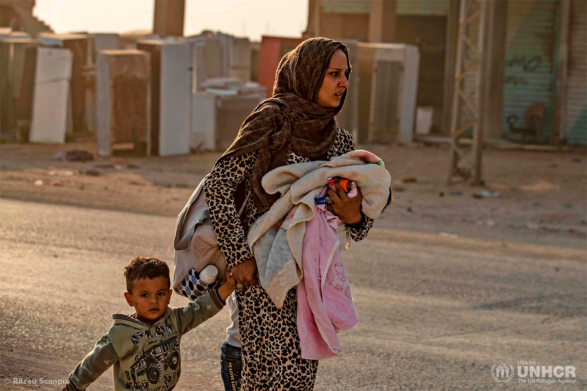 mother and children flee northern Syria