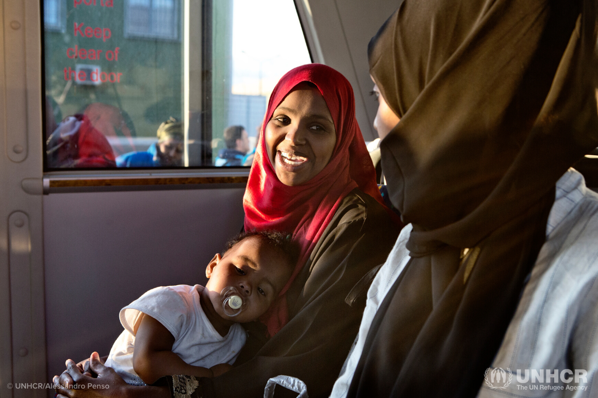 Somali mother sitting on bus with her baby