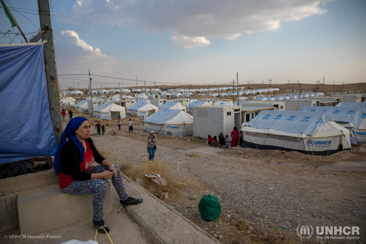 Syrian refugee looking out over a refugee camp in Iraq