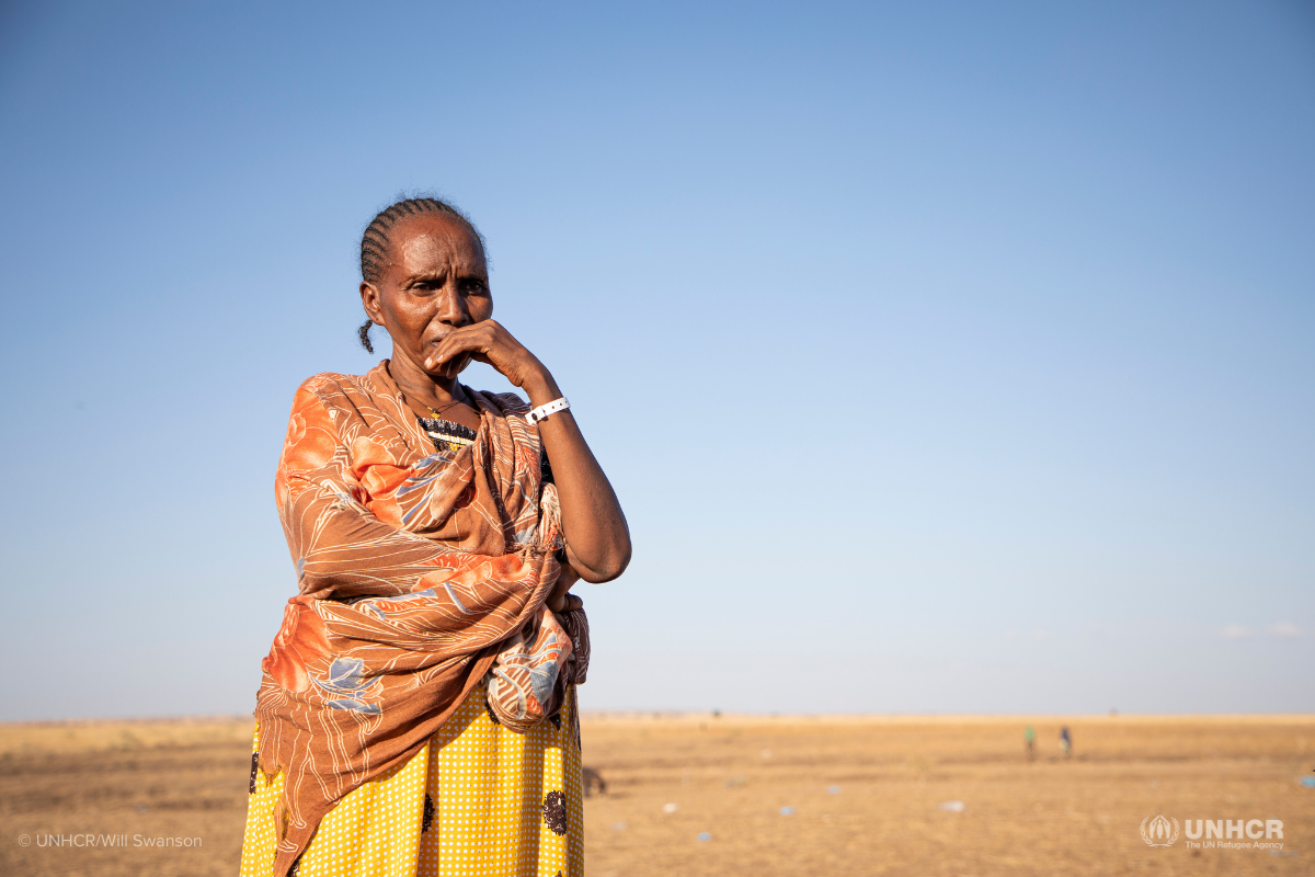 Woman standing after crossing from northern Ethiopia into Sudan in 2021