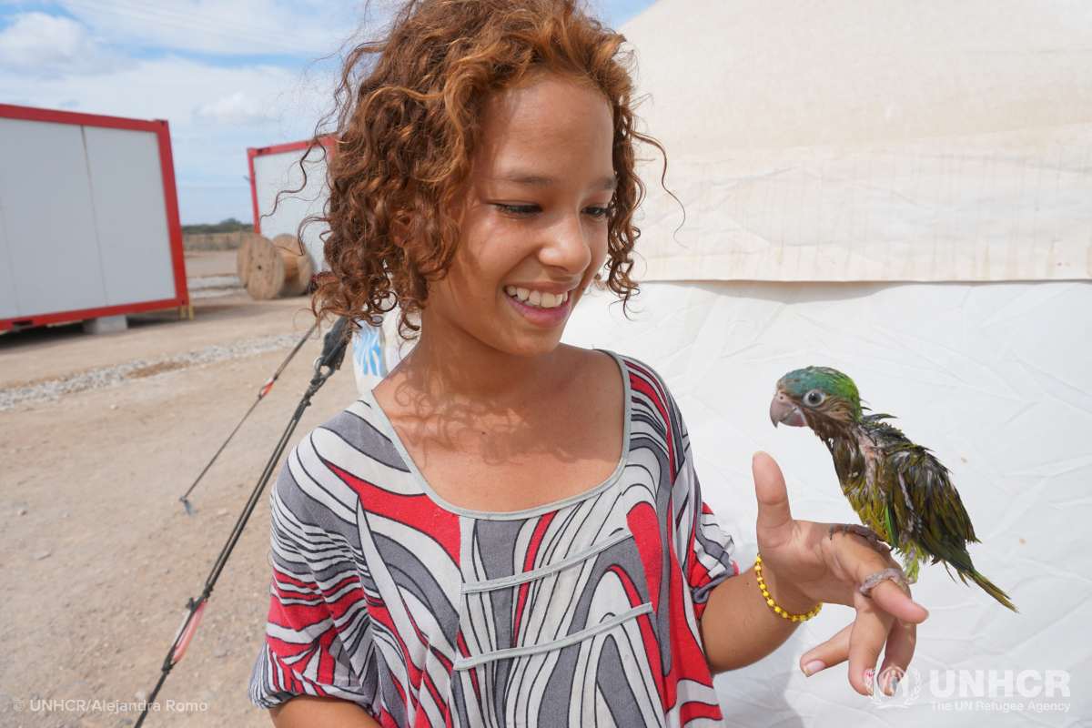 Venezuelan Egliana and her bird Felicia