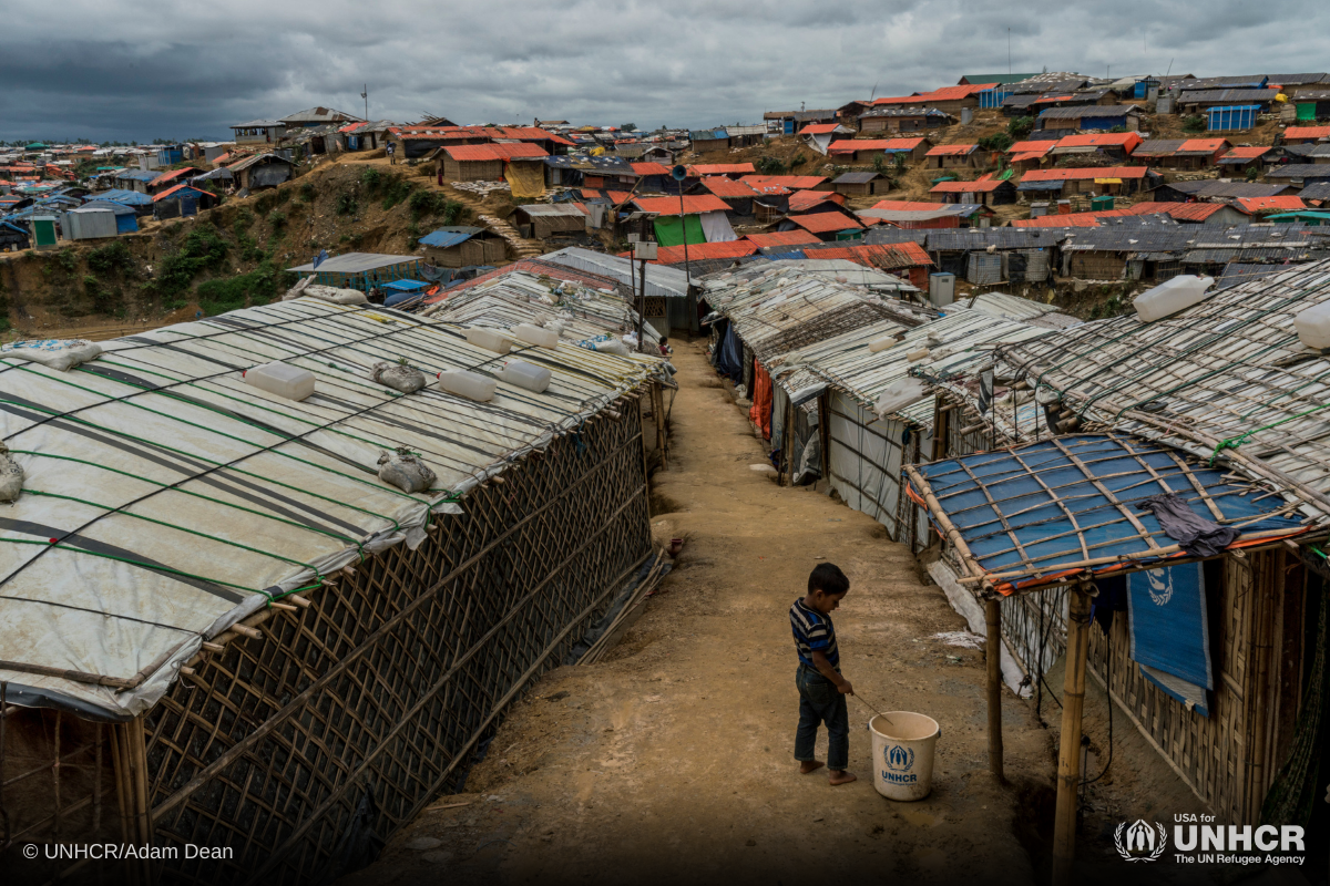 A boy stands between shelters on raised ground at Kutupalong refugee camp, where an operation to relocate thousands of families at risk from the monsoon downpours is underway.
