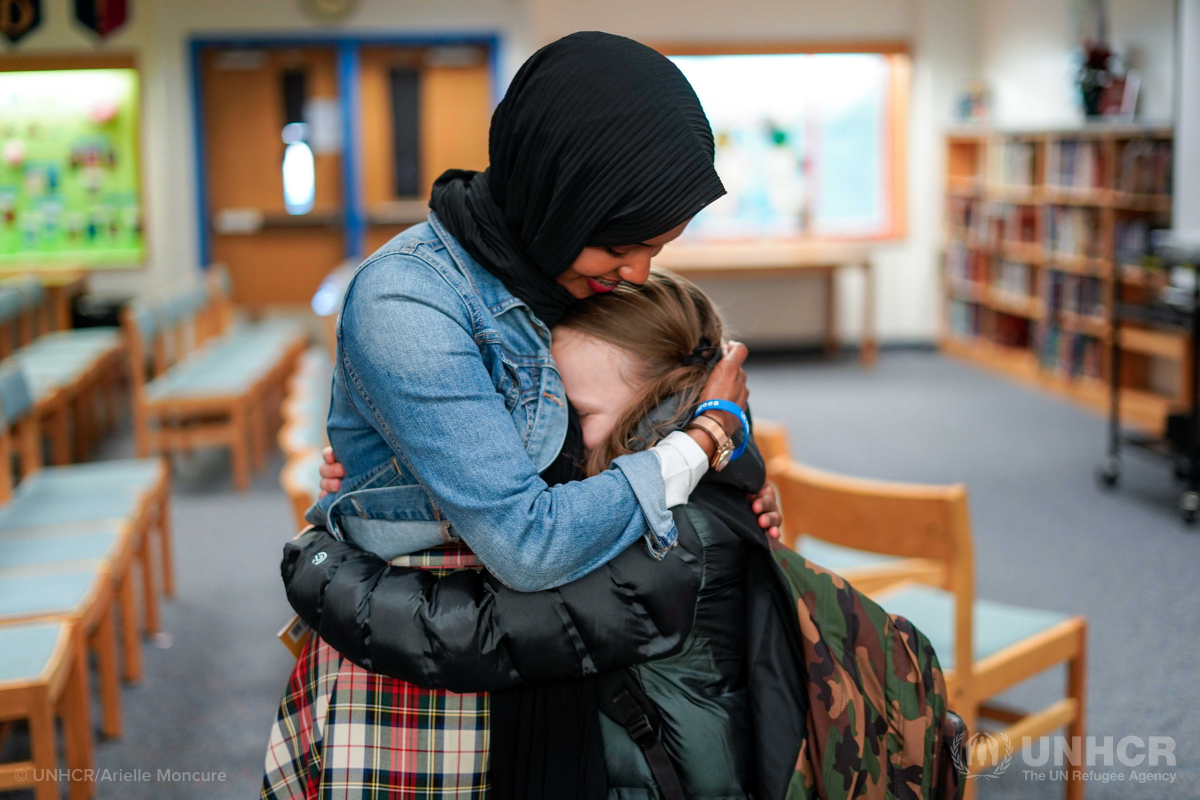 Habso Mohamud hugging little girl