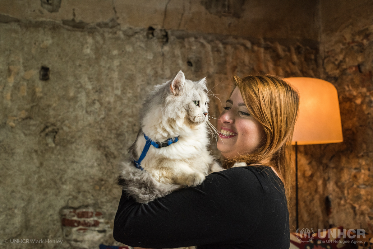 Syrian refugee Darin and her cat Caesar