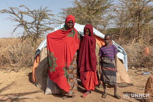 Thousands of families have been displaced due to recent climate change and droughts in Ethiopia's Somali regions. An Ethiopian mother stands in front of her home next to her daughter and son.