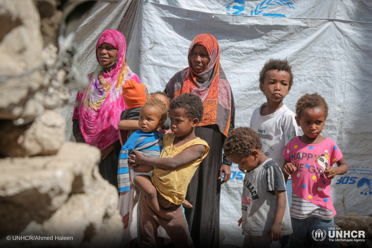 Displaced Yemeni mother, Gabra (in pink) and her family, in a hosting site in Sana’a.