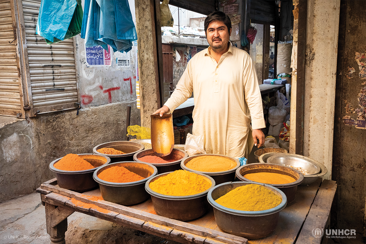 azeem displaying the spices at his shop