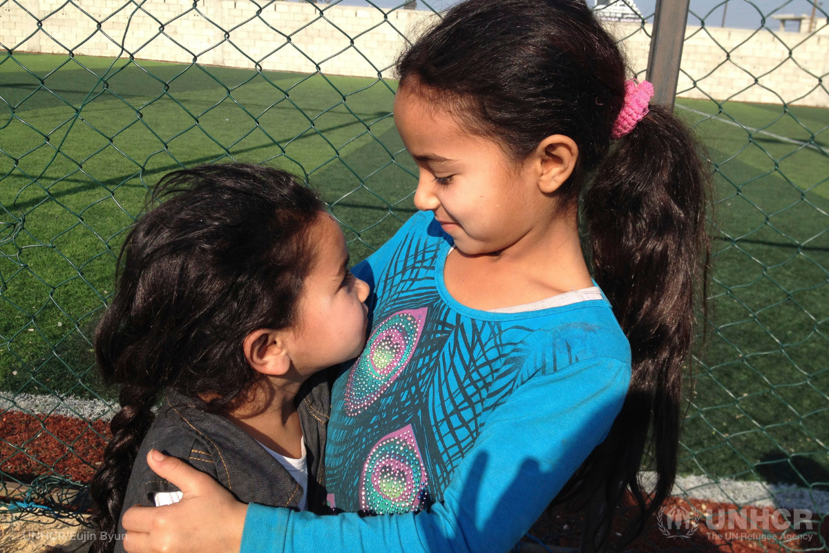 Refugee sisters hugging