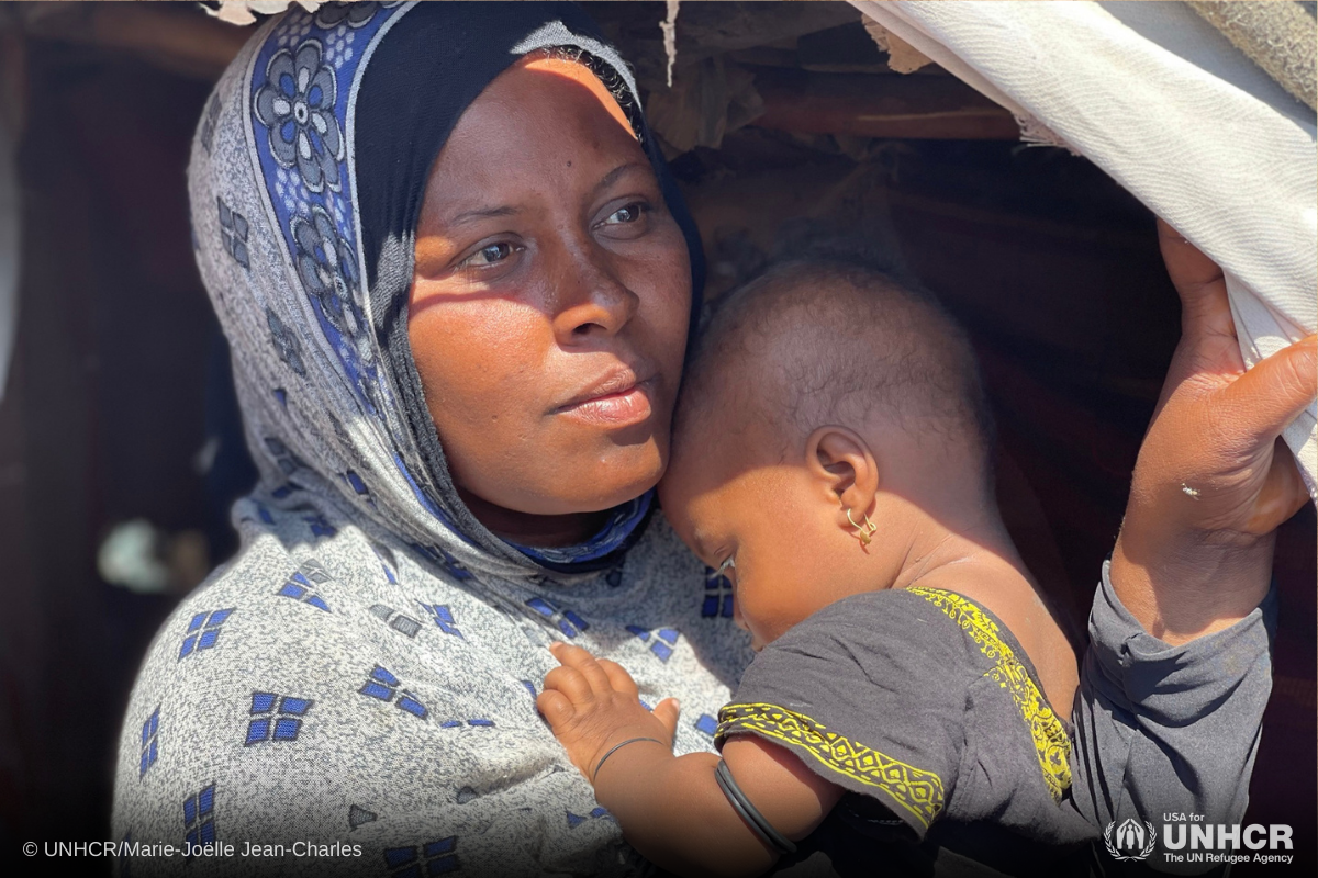 Internally displaced mother holding her baby girl.