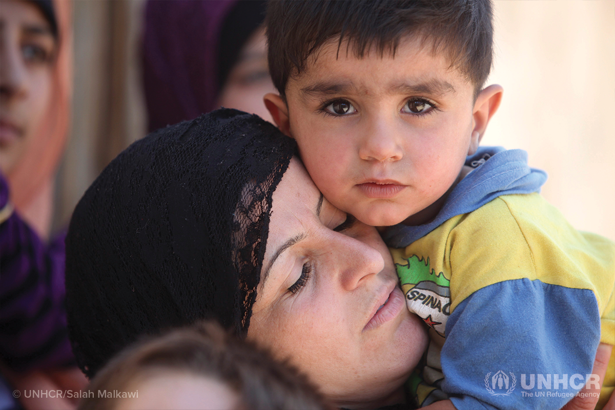 syrian mother holds her child