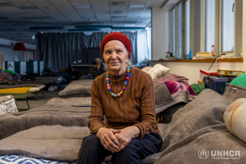Valentina, 83, sits on her bed at a shelter in Kraków. Her New Year wish is to return to Ukraine.