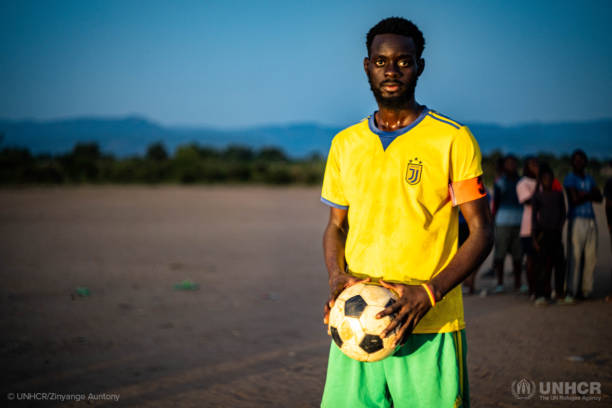 democratic republic of the congo refugee holds a soccer ball
