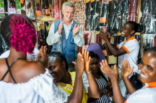 Filippo Grandi, the UN High Commissioner for Refugees, visits a hair salon started by Elodie Guei Sahe, who fled Côte d’Ivoire in 2011. She returned to her hometown, Bably-Vaya village, in 2020 and opened her salon with help from UNHCR. 