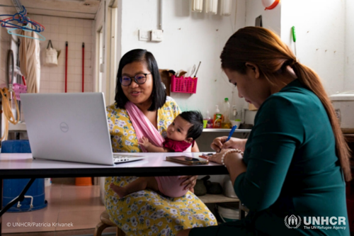 Deborah and Kip, from the Myanmar Ethnic Women Refugee Organization, conducting a virtual support group session with other refugee women.