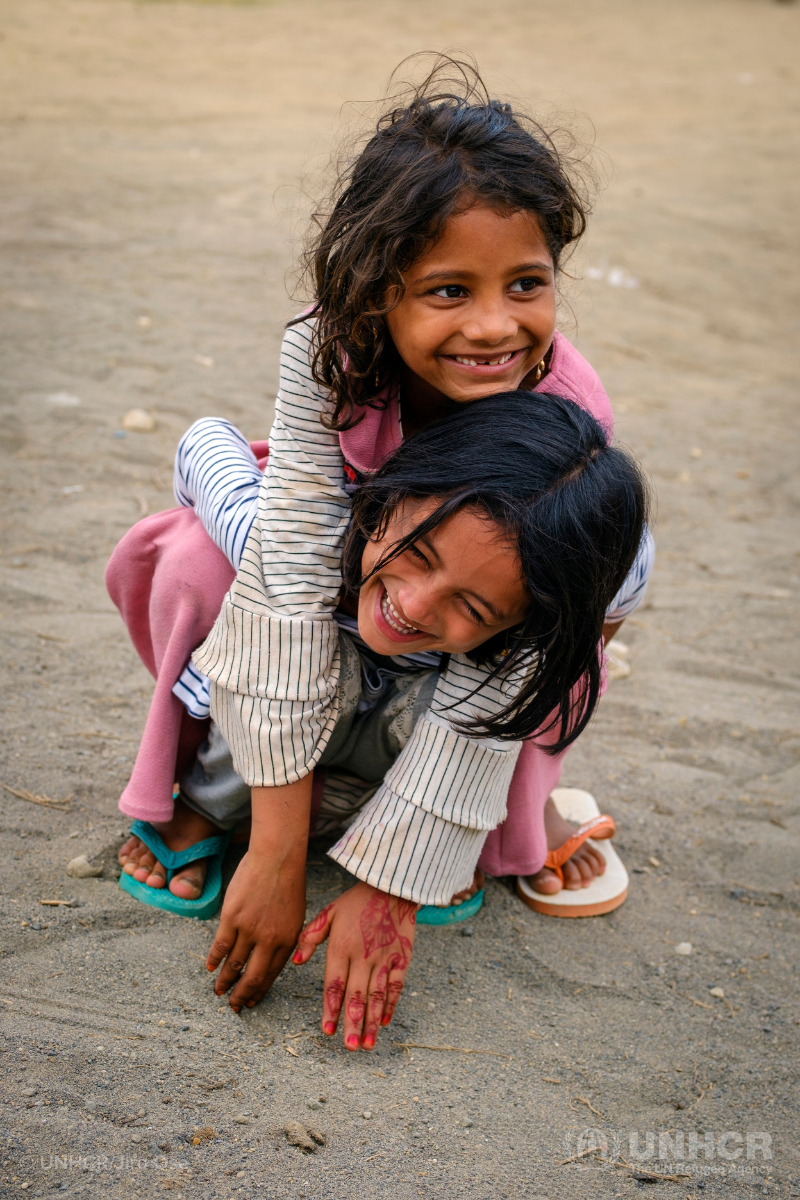 Rohingya refugees and best friends play together