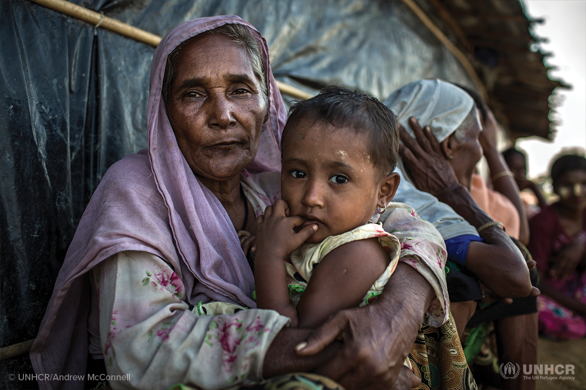 rohingya woman holds child