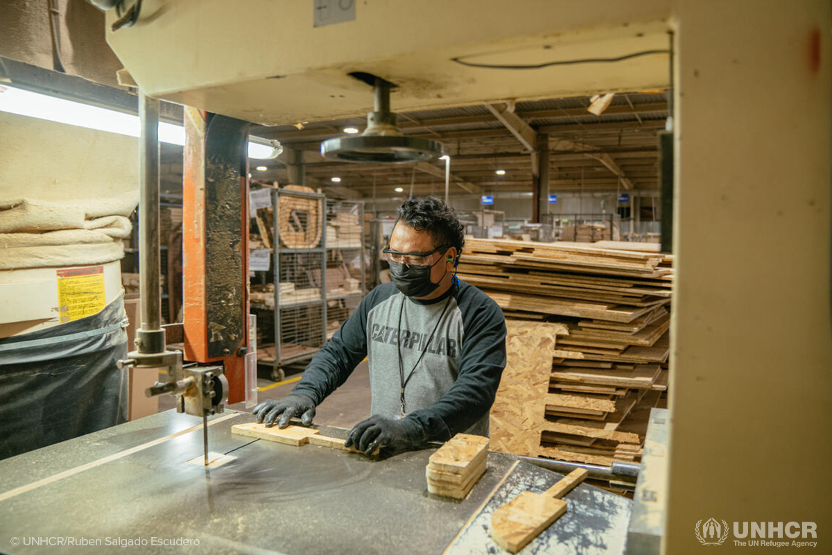cesar working in a furniture plant