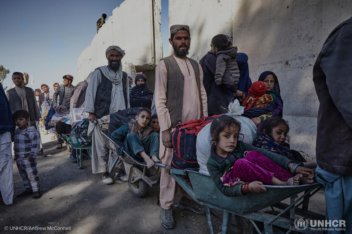 Afghans queue to enter Pakistan at the Spin Boldak border crossing in December
