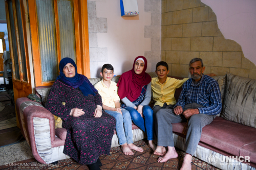 Um and Abu Safwan, are pictured with their two grandchildren, Ammar, 12 (L) and Majid, 13 (R) and daughter Lubna.