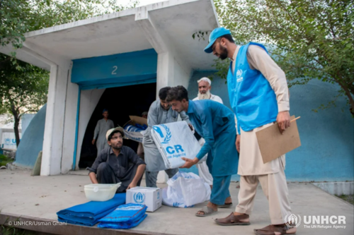UNHCR staff deliver emergency relief items to Afghan refugees in Kheshgi refugee village in Pakistan’s north-western Khyber Pakhtunkhwa province. 