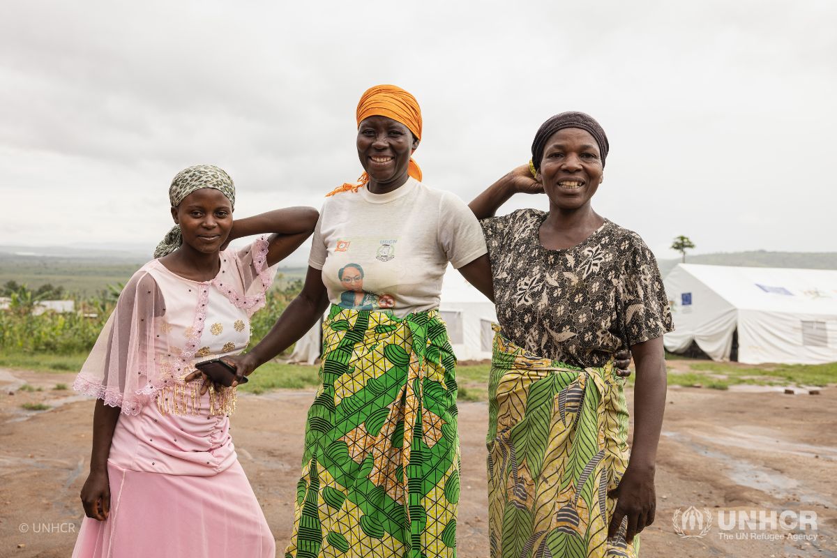 Three refugee women standing together