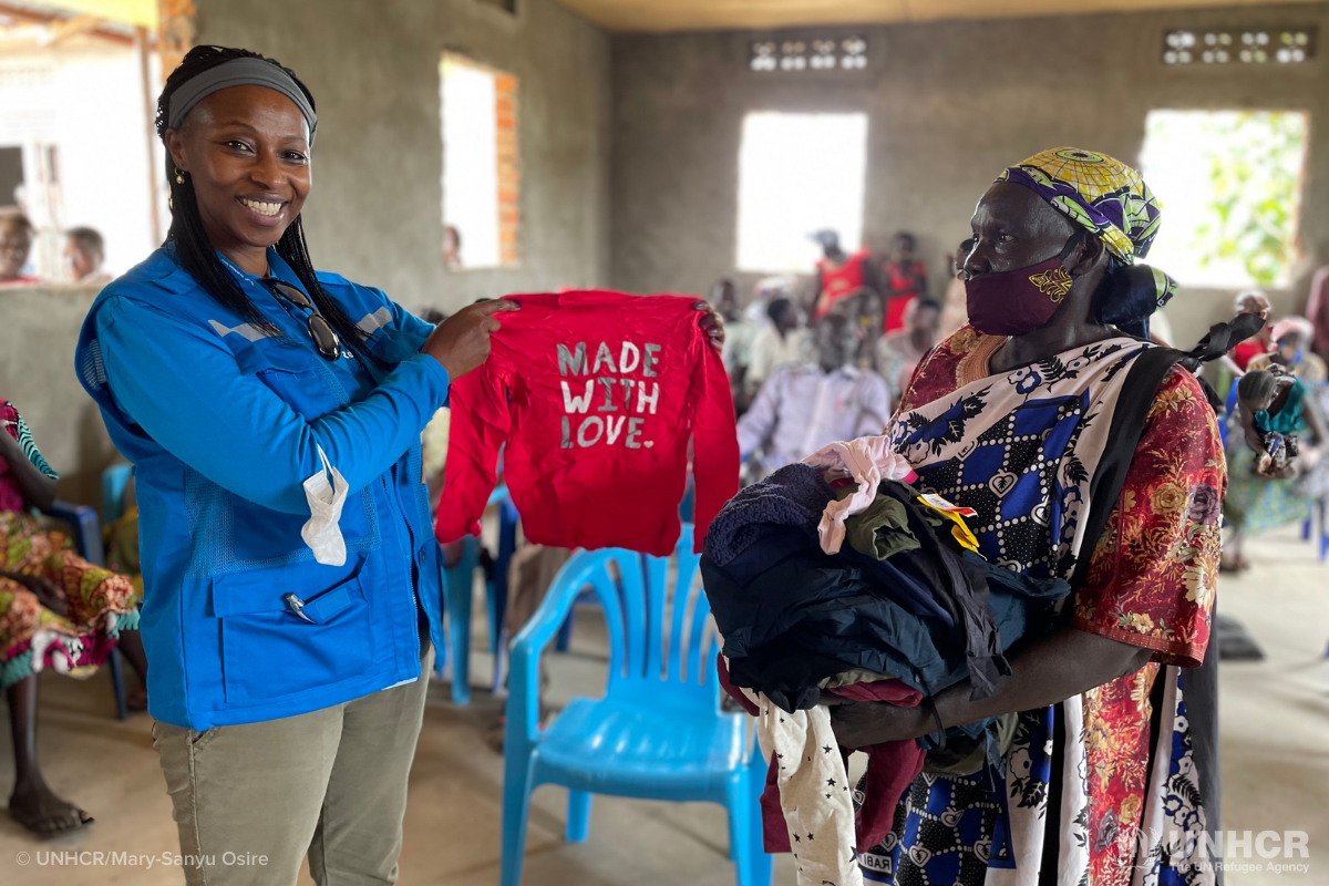 UNHCR Deputy Representative Juliette Murekeyisoni distributes donated clothing in South Sudan